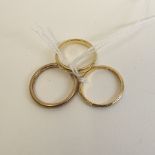 A 9ct gold wedding band, an 18ct band and a 22ct band