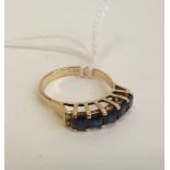 A 9ct gold ring set with five sapphires