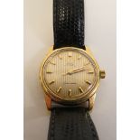 A gents 9ct gold Omega automatic Seamaster with Omega buckle