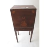 An Edwardian inlaid mahogany decanter box on square tapering legs and brass carrying handles, 21 1/2