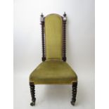 A Victorian mahogany upholstered nursing/side chair with barley twist columns and front legs with