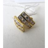 A pair of yellow metal, gold coloured diamond set ear studs, each set with two lines of four