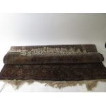 A hand woven central Persian, blue ground rug with central medallion, floral decoration,