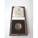 A boxed Britannia 1/10oz proof gold coin