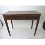 An early 19th century string inlaid mahogany side table with crossbanded top over a long drawer,