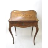 A late 19th century walnut, string and marquetry inlaid ladies' writing bureau having ormolu mounts,