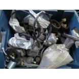 A box of used MZ carburetors and manifolds