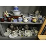A mixed assortment of china to include a teaset, blue and white oil lamp and a Belgium art pottery
