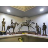 Five Spelter figures to include one with a plaque inscribed Royal Military Police 1855-1995
