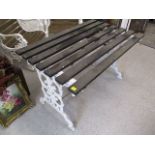 A white painted, wrought iron garden table, 27 h, 44 w, 28 d