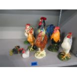 A collection of pottery hens