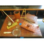 A leather desk set and pen holder, together with other desk related items and a painted wall mirror