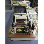 An Olympia Carina 2 cased typewriter and a Frister and Rossman cased sewing machine