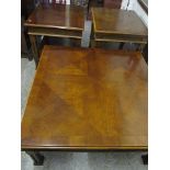 A pair of late 20th century American mahogany, two tier lamp tables with fretwork and a matching