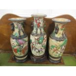 Three late 19th century crackle glazed vases decorated with warriors on stands, 10 h