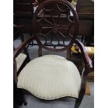 A pair of reproduction mahogany corner chairs with cream upholstery, a matched open armchair and a