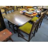 A mid 20th century dark Ercol dining table, 28 3/4 h x 59 1/2 w, and four matching chairs