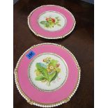 A pair of Victorian plates with pink banding and floral centres