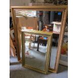 A large modern, gilt wall mirror having bevelled glass, 45 x 34 1/2, together with a smaller mirror,