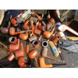 A collection of pipes to include a cased Meerschaum pipe, Savinells and Petersons