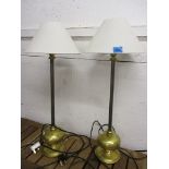 A pair of brass table lamps and an abstract vase