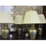 Four Eastern inspired brass table lamps, a pair of barley twist mahogany effect and metal table