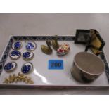 An oriental ceramic tray containing trinkets to include enamelled buttons and a silver pot with lid