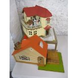 A Sylvanian house and summer house, Sylvanian cow and beaver figures along with a large quantity