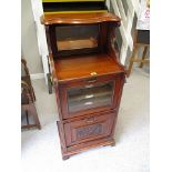 A late Victorian mahogany music cabinet with a glazed door and fall front, 6 h, 18 w