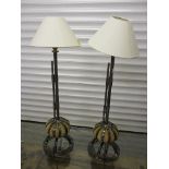 A pair of modern, wrought iron table lamps