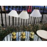 Three modern brass table lamps