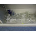 A mixed lot of glass to include cut glass whisky tumblers, sherry glasses, a blue glass vase and