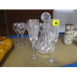 A Waterford decanter with stopper, three Waterford Champagne flutes and seven wine glasses