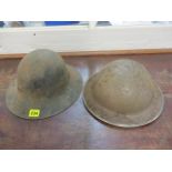 Two tin plate helmets