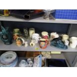 A mixed lot to include a Murano fish-shaped glass jug, Toby jugs and Coronation mugs