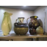A selection of water jugs and other ceramics to include a Buckfast Abbey water jug, 10 h