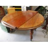 A late Victorian extending mahogany oval dining table, on turned legs, measurement when not extended