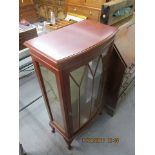 A modern mahogany, bow front display cabinet on cabriole feet, 45h, 24 w, 15 d