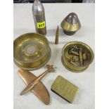 Trench art to include an ashtray inset with a Falkland Islands 1980 coin, a copper aeroplane, an