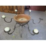 A modern, wrought iron table pricket stand