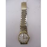 Omega - gents De Ville, automatic, 9ct gold cased wrist watch with an off white baton dial and date,