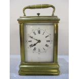 A late 19th century miniature brass carriage clock, with white enamel dial signed Dent, Cockspur?