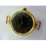 An early 20th century 18ct gold Officers wristwatch with black dial signed The Bahadur, Swiss