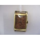 A 1930s gents 9ct gold, rectangular Cyma wristwatch head, the gold case bearing import mark for