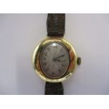 An early 20th century ladies 18ct gold early 20th century wristwatch with oval dial, the oval