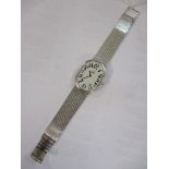 Dunhill - a gents mechanical hand wind, white gold plates wristwatch, with a white Arabic dial, on