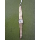 Omega - ladies mechanical, 9ct gold wrist watch with a silvered baton dial, on a flexible strap,