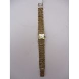 Omega - ladies mechanical hand wound, 9ct gold wristwatch, with a gold coloured baton dial on an