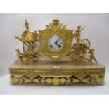 A late 19th century French gilt metal cased mantle clock having a foliate and grape design on a