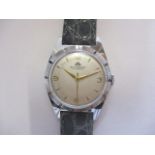 A gents chrome plated Bucherer wristwatch, circa 1950. The signed, silvered dial with gilt baton/